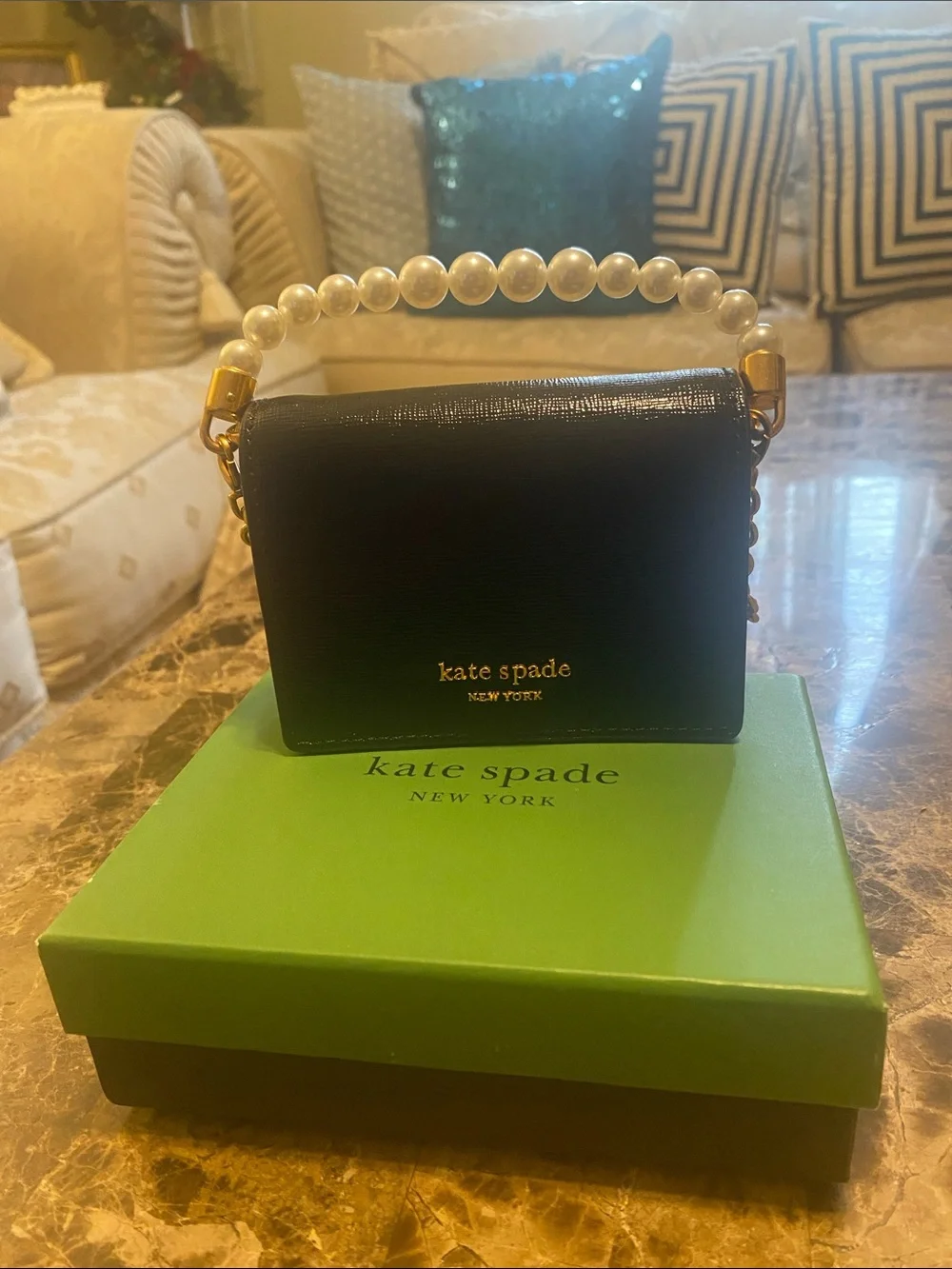 kate spade Black Mini Pearl-Handle Crossbody. The box is included.